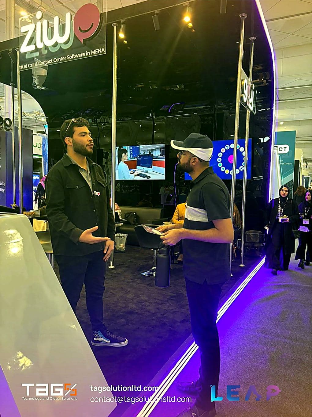 Discussing a platform at an exhibitor stand during LEAP